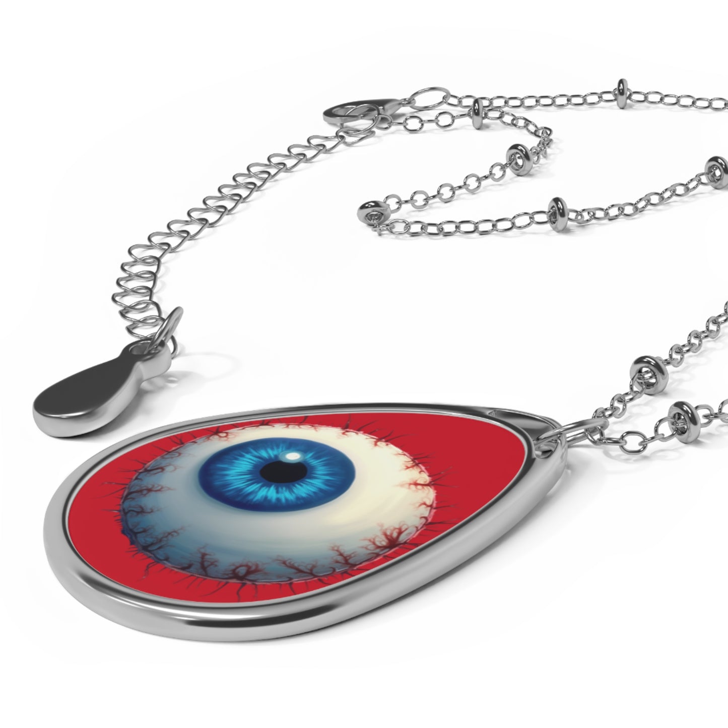 Evil Eye Teardrop Necklace — Blue Eye Oval Pendant on Red Background